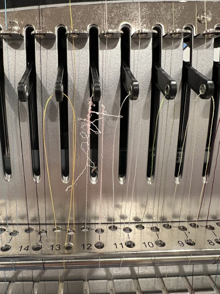 Thread break and bird's nest on embroidery machine needle 12